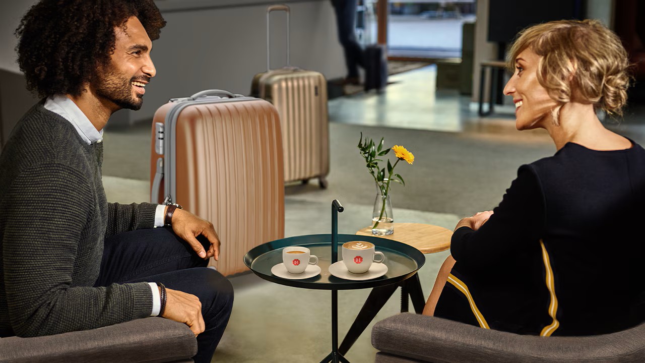 hotel guests having a coffee in the hotel lobby upon arrival